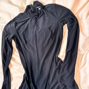 Tommy Hilfiger: high neck, simple detail around the neckline, long sleeves